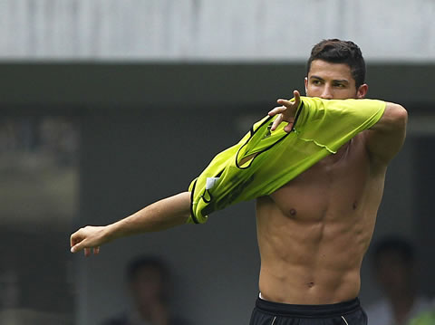 Cristiano Ronaldo taking off his shirt and showing his chest and body, in Real Madrid photo in practice 2011-2012