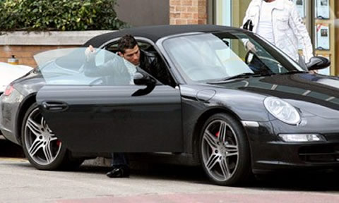 Cristiano Ronaldo getting in his Porsche 911 Cabriolet