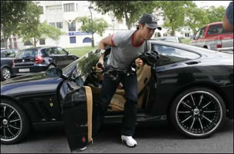 Cristiano Ronaldo leaving one of his Ferraris