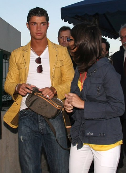 Cristiano Ronaldo fashion holding a Louis Vuitton purse and a yellow jacket