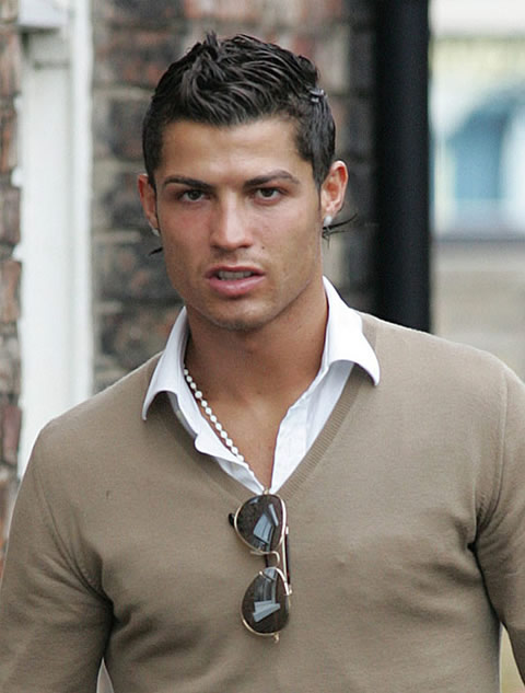 Cristiano Ronaldo fashion with a grey t-shirt and sunglasses hanged