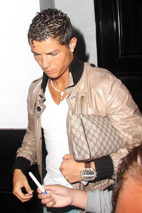 Cristiano Ronaldo fashion with a purse