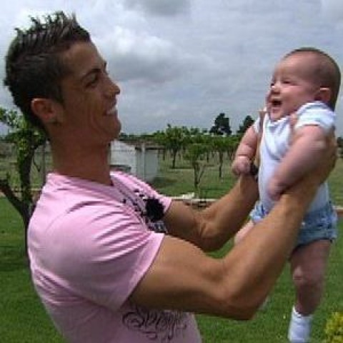 Cristiano Ronaldo holding his son, Cristiano Ronaldo Jr.