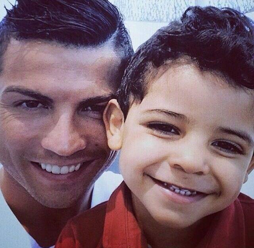 The father Cristiano Ronaldo with his son Cristiano Ronaldo Junior in 2014