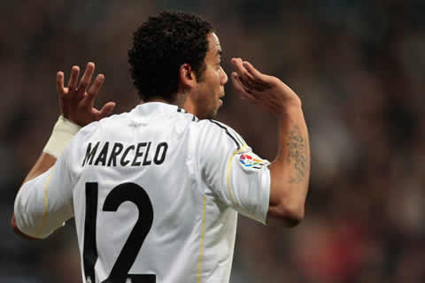 Marcelo claiming for innocence to the referee, after a potential foul in a Real Madrid 2011-2012