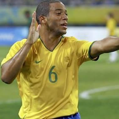 Marcelo making funny movements in a Brazil jersey