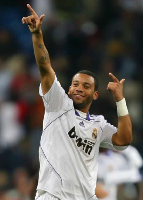 Marcelo celebrating a goal in Real Madrid in a move gesture similar to Usain Bolt's trademark celebration in Real Madrid 2007-2008 season