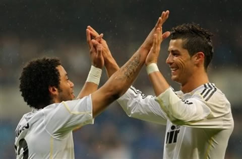 Marcelo touching hands with Cristiano Ronaldo in Real Madrid 2010-11