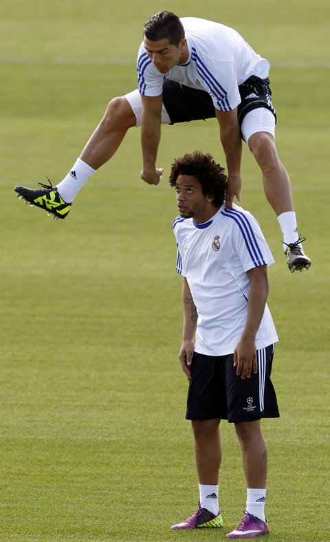 Cristiano Ronaldo jumping over Marcelo in Real Madrid practice and training session in 2011/2012