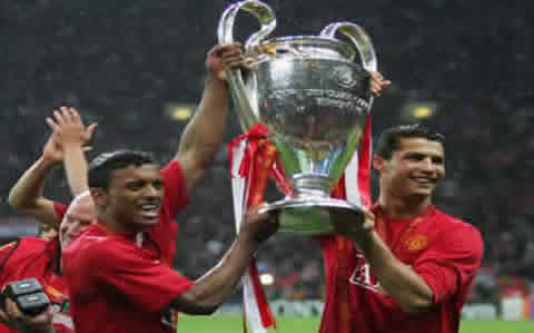 Nani and Cristiano Ronaldo holding the UEFA Champions League trophy in Manchester United