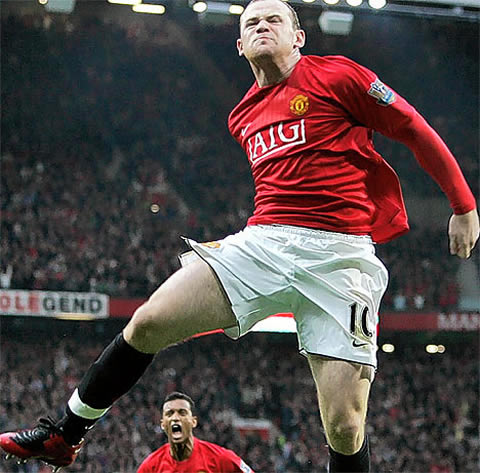 Wayne Rooney jumping high to celebrate a goal for Manchester United