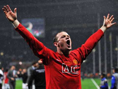 Wayne Rooney celebrating a trophy won for Manchester United with the fans and raising his arms to the crowd