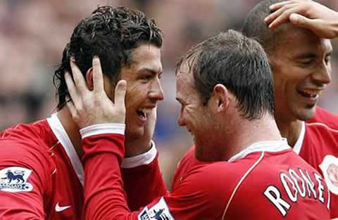 Wayne Rooney showing his affection for Cristiano Ronaldo during a celebration of a Manchester United goal