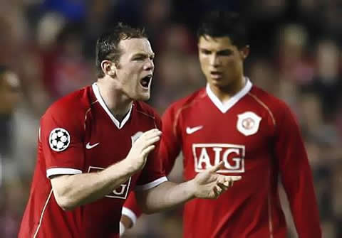 Wayne Rooney clapping and incentivating/motivating his Manchester United teammates in fury/rage, with Ronaldo coming from behind