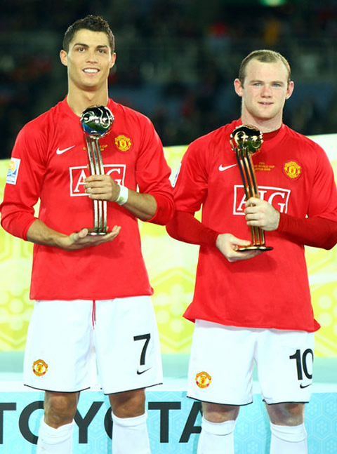 Wayne Rooney and Cristiano Ronaldo holding a trophy awarded to each one of them