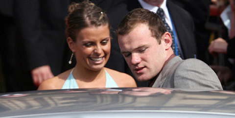 Wayne Rooney with girlfriend/wife, Coleen McLoughlin entering a car
