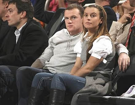 Wayne Rooney and girlfriend/wife, Coleen McLoughlin together in the stadium