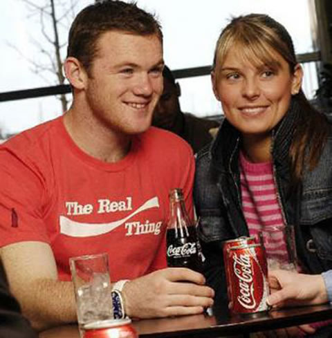 Wayne Rooney with girlfriend/wife, Coleen McLoughlin drinking coca-cola