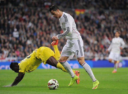 Cristiano Ronaldo pushes a defender to the ground and prepares to finish the play