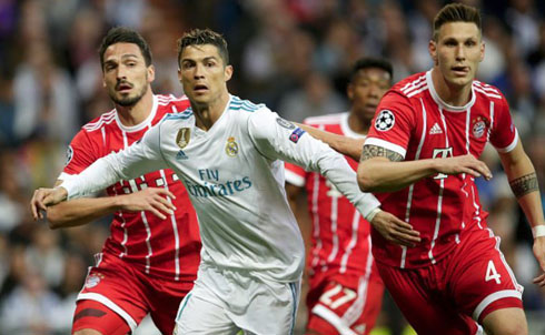 Cristiano Ronaldo defended by multiple Bayern Munich players