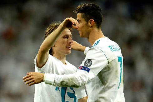 Cristiano Ronaldo hugging Luka Modric in a Real Madrid Champions League game