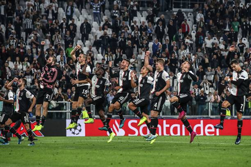 Juventus players doing the traditional jump in front of their home crowd at the Allianz Stadium