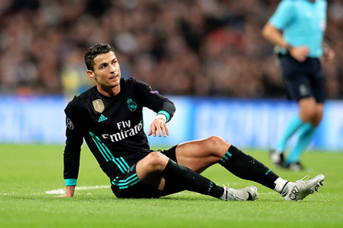 Cristiano Ronaldo prepares to stand up after he got taken down