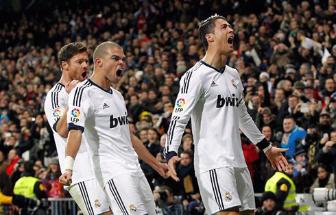 Xabi Alonso, Pepe and Cristiano Ronaldo screaming of joy after a Real Madrid goal against Atletico Madrid, in La Liga 2012-2013