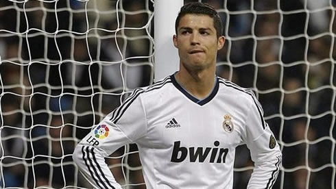 Cristiano Ronaldo biting his lips and standing near one of the posts, in Real Madrid vs Atletico Madrid for La Liga 2012-2013