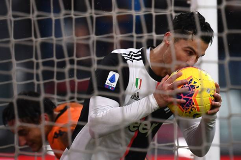 Cristiano Ronaldo kisses the ball after scoring the equalizer for Juventus