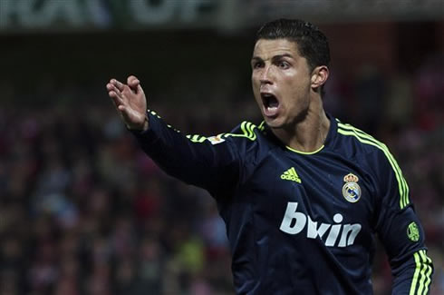 Cristiano Ronaldo waving and yelling at the referee, pointing at something during his game for Real Madrid in 2013