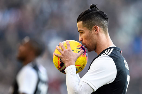 Cristiano Ronaldo kissing the football before taking a penalty-kick