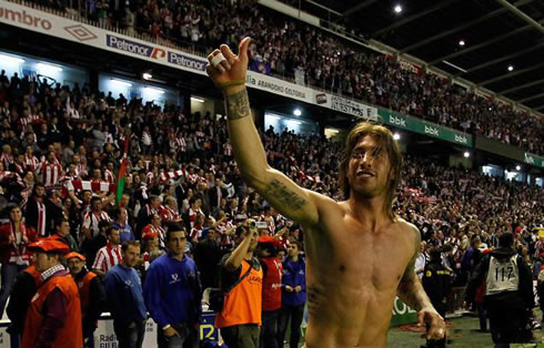 Sergio Ramos shirtless and showing his body naked, chest muscles and tatoos, as Real Madrid wins La Liga in San Mamés, against Athletic Bilbao in 2012