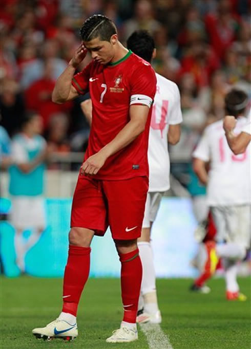 Cristiano Ronaldo puts his hand on his head as he reflects about what went wrong against Turkey