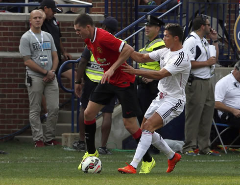 Cristiano Ronaldo holding a Manchester United player shirt, in a pre-season friendly for Real Madrid in 2014-2015