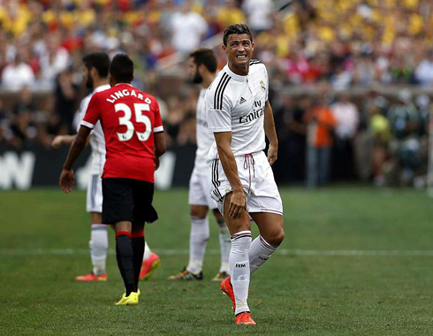 Cristiano Ronaldo holding his knee, in a Real Madrid pre-season friendly against Manchester United, in Michigan, United States