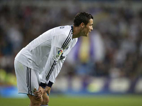 Cristiano Ronaldo showing how tired he is, by bending and catching some breath during Real Madrid game in 2012/2013