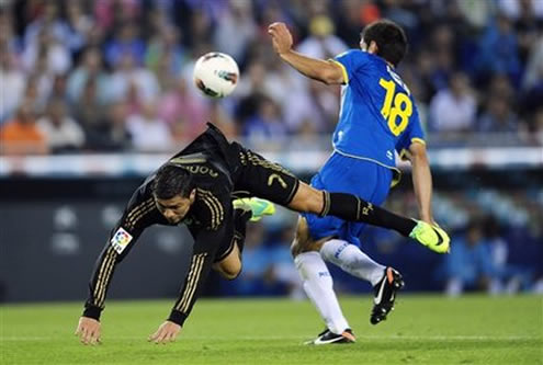 Cristiano Ronaldo getting knocked down in a dispute with an Espanyol defender