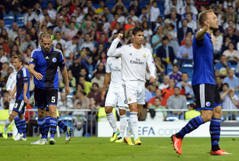 Cristiano Ronaldo pointing back as he walks around the Bernabéu during a Champions League match between Real Madrid and Copenhagen