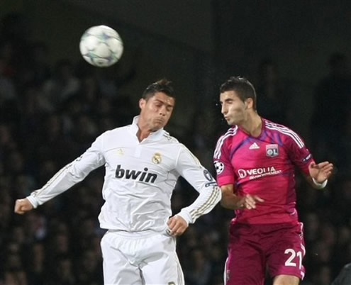 Cristiano Ronaldo disputes the ball in the air against Lyon