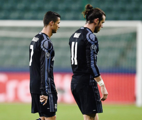Cristiano Ronaldo and Gareth Bale walking with their heads down