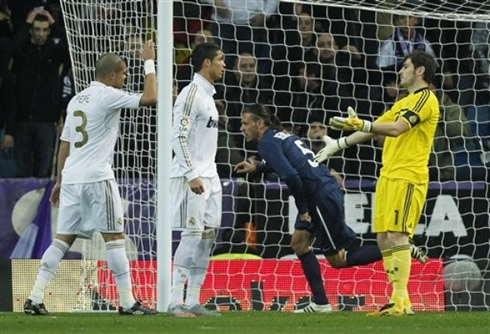 Pepe, Cristiano Ronaldo and Casillas discussing with each other, after Demichelis scored a goal for Malaga