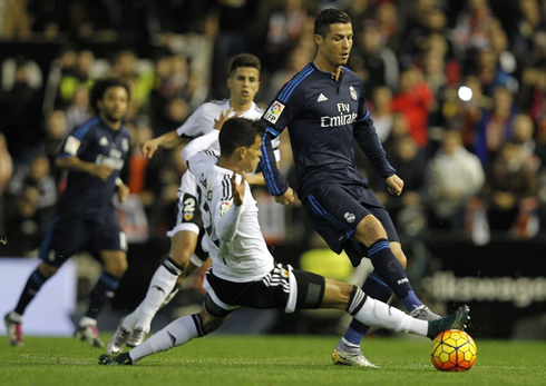 Cristiano Ronaldo about to get tackled in Valencia vs Real Madrid
