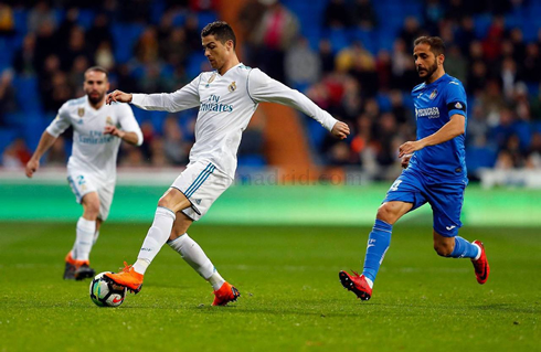 Cristiano Ronaldo controls the ball with his left foot