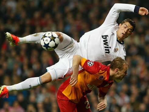 Cristiano Ronaldo jumping over a defender to make a shot completely suspended in the air, in Real Madrid vs Galatasaray in 2013