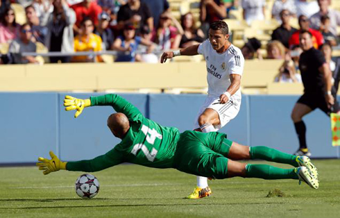 Cristiano Ronaldo scoring for Real Madrid against Everton's Tim Howard, in pre-season 2013-2014