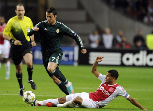 Cristiano Ronaldo getting past an Ajax defender, at the UEFA Champions League 2012-2013