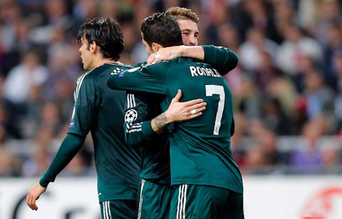 Cristiano Ronaldo hugging Sergio Ramos, with Kaká heading back to his side half, in the UEFA Champions League 2012-2013