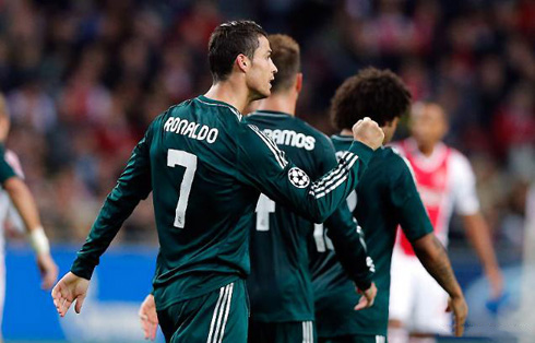 Cristiano Ronaldo walking back to Real Madrid side and showing his fist closed, as a way to celebrate another goal to his count