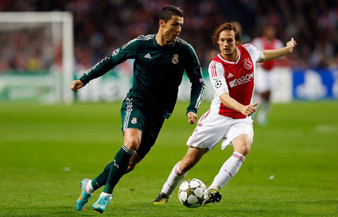 Cristiano Ronaldo running with the ball during the game between Ajax and Real Madrid, in 2012